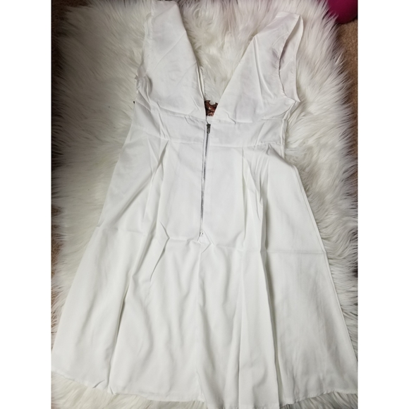 Floral embroidered mini white dress Medium and Large available - Picture 9 of 9